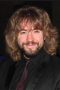 Porträt von Justin Lee Collins