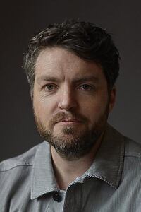 Porträt von Tom Burke